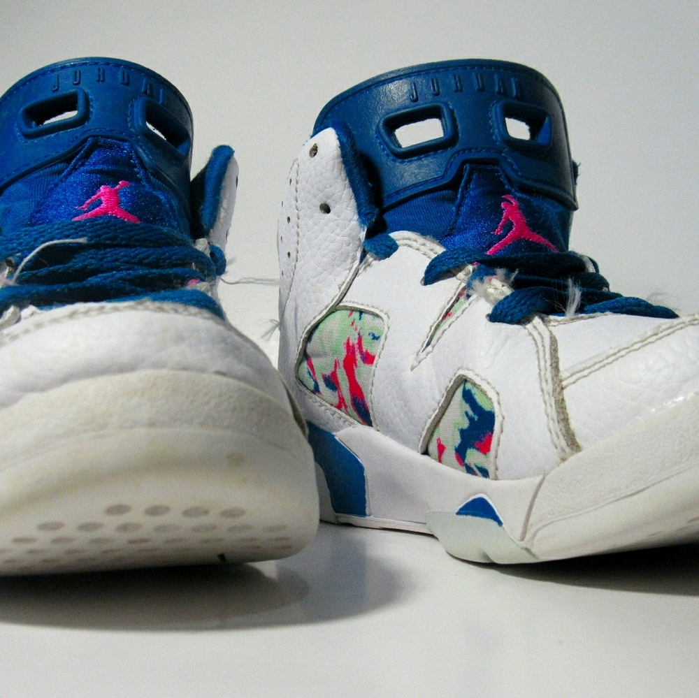 White pink and blue jordans